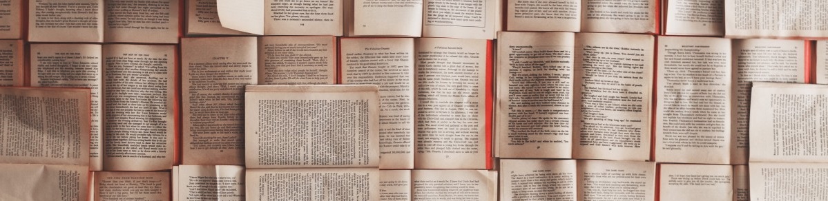 Stock photograph of a lot of books lying open, next to each other